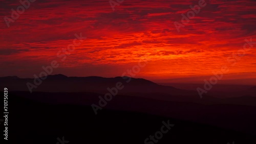 A fiery red sky over the Arenig mountains in North Wales UK photo