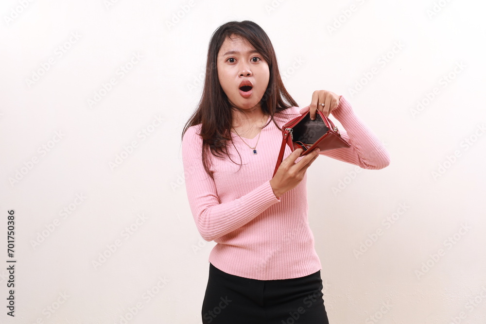 Wow shocked expression of young asian girl showing an empty wallet. Isolated on white background Wow shocked expression of young asian girl showing an empty wallet. Isolated on white background