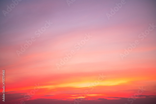 Fototapeta Naklejka Na Ścianę i Meble -  Beautiful of luxury soft gradient orange gold clouds and sunlight on the blue sky perfect for the background, take in everning,Twilight