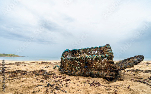Washed up lobster pot on a Welsh beach