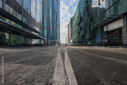A street with skyscrapers with road markings in winter in Moscow City.