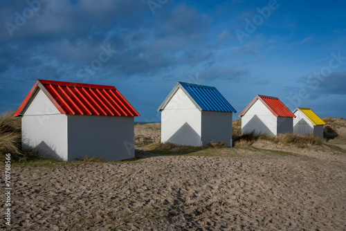 Gouville, France - 12 30 2023: View of colorful bathing wooden cabins of Gouville on the dunes.