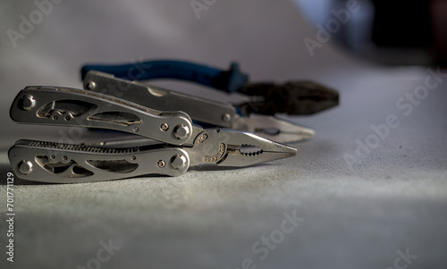 Photo of pliers set on the gray background