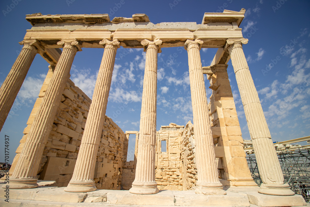Ancient Parthenon Temple on top of the Acropolis Athens, Greece at sunny day with a blue sky. The landmark of Athens. Parthenon is the temple of for dedication to the goddess Athena. Ancient Parthenon Temple on top of the Acropolis Athens, Greece at sunny day with a blue sky. The landmark of Athens. Parthenon is the temple of for dedication to the goddess Athena.