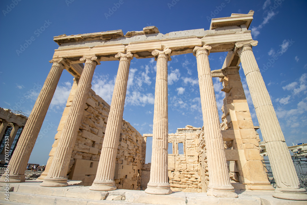 Ancient Parthenon Temple on top of the Acropolis Athens, Greece at sunny day with a blue sky. The landmark of Athens. Parthenon is the temple of for dedication to the goddess Athena. 