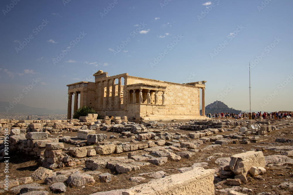 Ancient Parthenon Temple on top of the Acropolis Athens, Greece at sunny day with a blue sky. The landmark of Athens. Parthenon is the temple of for dedication to the goddess Athena.