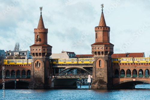 yellow subway train crossing oberbaum Bridge in Berlin
