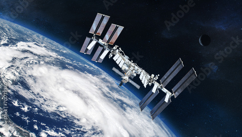 ISS with solar panel discovery Earth atmosphere. Element of this image furnished by NASA. photo