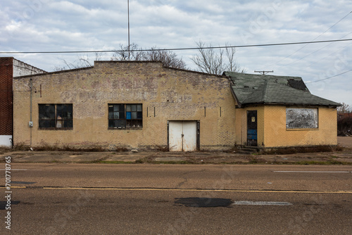 Abandoned yellow brick warehouse left to rot in urban Jackson Mississippi © Richard