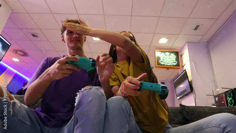 sister and brother gamers playing game console while having fun