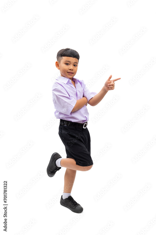 finger point up and side. Thai school uniform with backpack bag. Portrait Young Asian cute boy standing on white studio background banner. Back to school. finger point up and side. Thai school uniform with backpack bag. Portrait Young Asian cute boy standing on white studio background banner. Back to school.