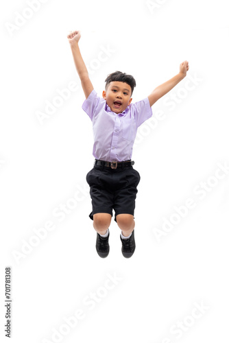 Excited yes wow jumping hand up in the air. Thai school uniform with backpack bag. Portrait Young Asian excite cute boy standing on white background banner. Back to school. © NVB Stocker