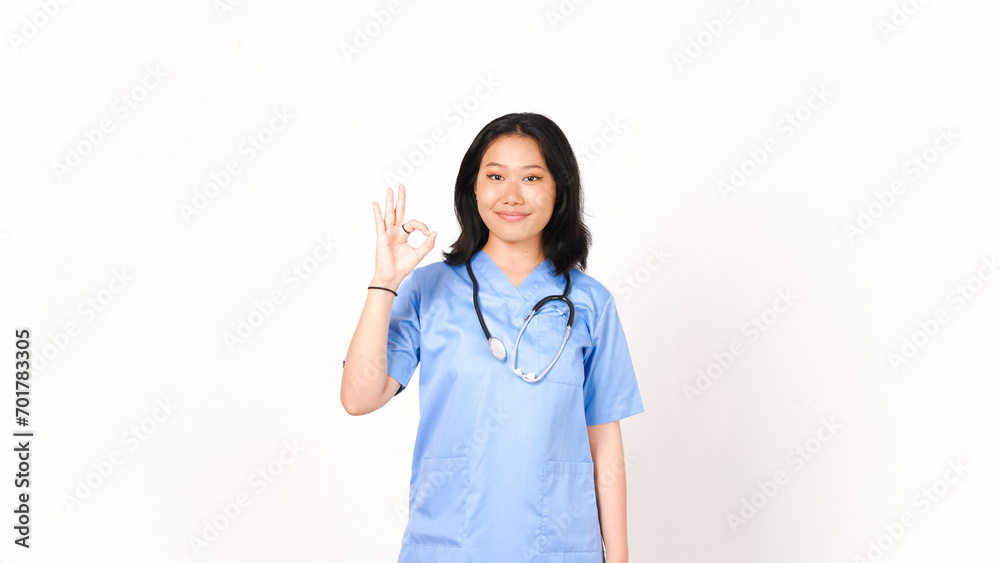 Young Asian female doctor showing okay sign isolated on white background Young Asian female doctor showing okay sign isolated on white background