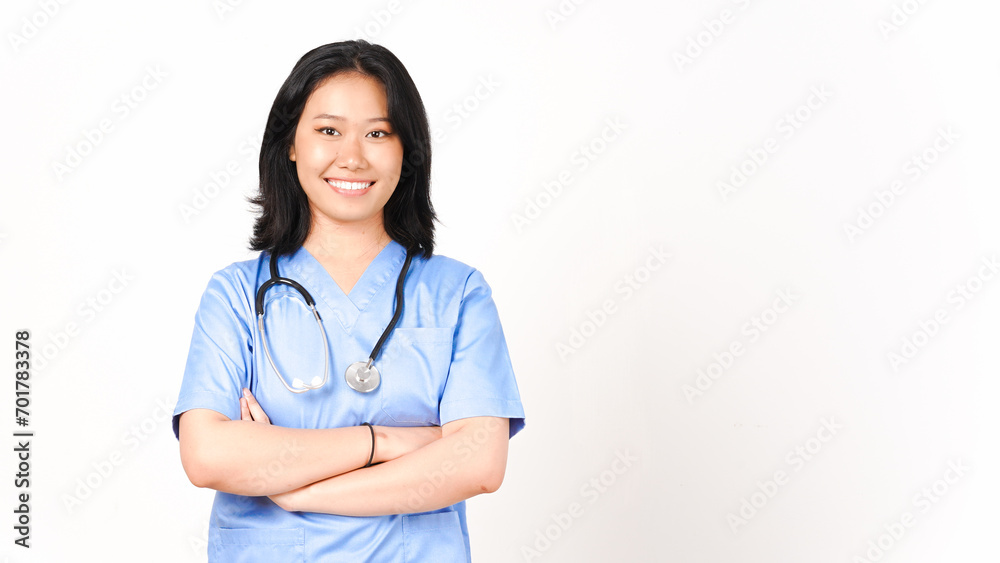 Young Asian female doctor folding arms smiling and looking at camera isolated on white background Young Asian female doctor folding arms smiling and looking at camera isolated on white background