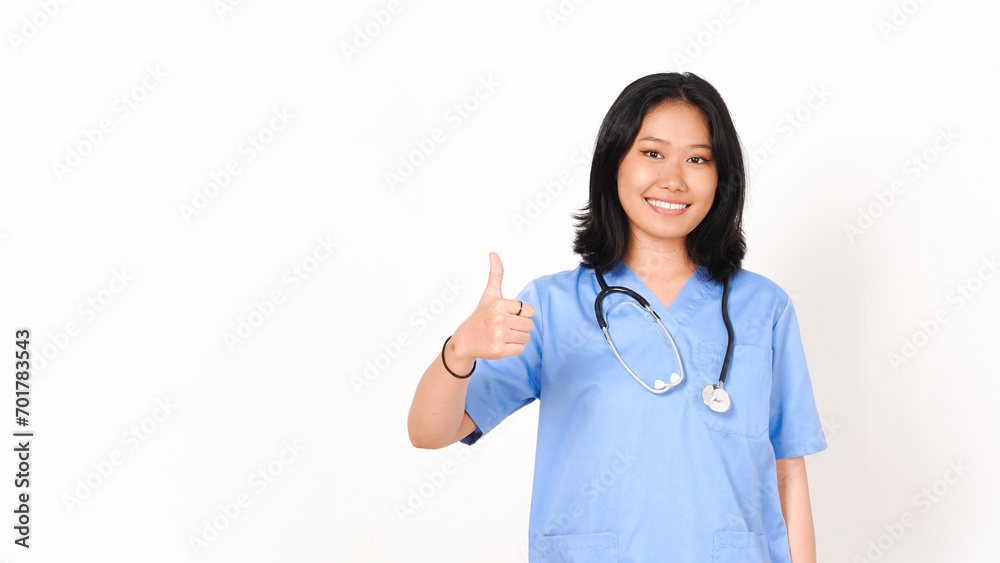 Young Asian female doctor showing thumbs up isolated on white background Young Asian female doctor showing thumbs up isolated on white background