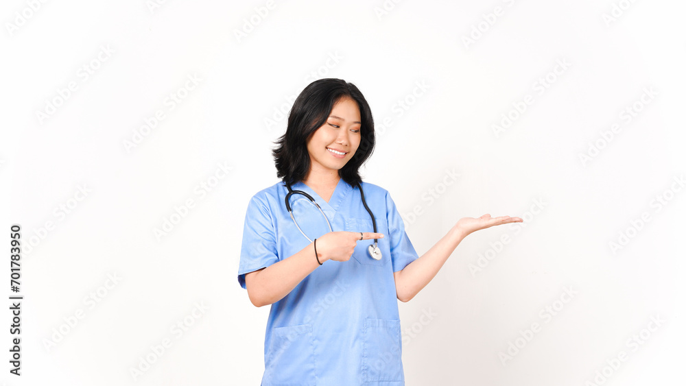 Young Asian female doctor pointing copy space on palm hand isolated on white background Young Asian female doctor pointing copy space on palm hand isolated on white background