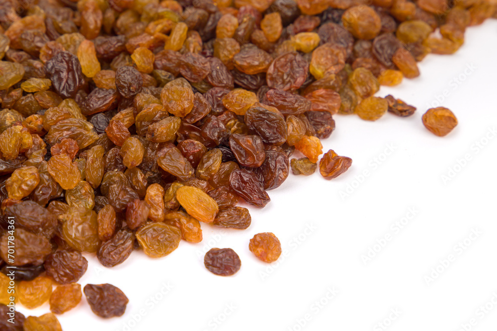 Raisins on white background. Close-up image. Raisins on white background. Close-up image.