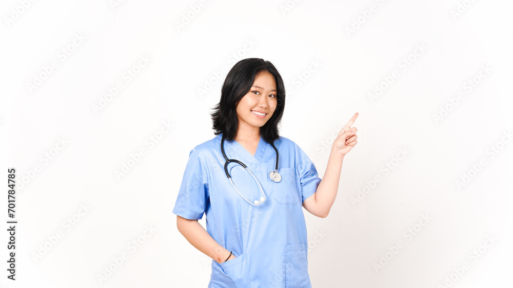 Young Asian female doctor pointing side copy space isolated on white background Young Asian female doctor pointing side copy space isolated on white background