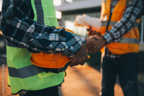 Team Construction or engineering group and worker. Teamwork and determination to succeed. Safety hard hat to prevent accident while working Transport and Container Team. Concept Restart and new Normal