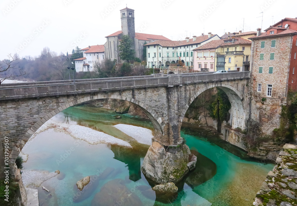 OLD bridge called PONTE DEL DIAVOLO which means  devil s bridge in Italian of the town of CIVIDALE in the province of UDINE in Italy and the Natisone river