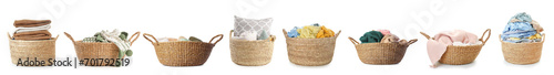 Set of wicker baskets with laundry isolated on white