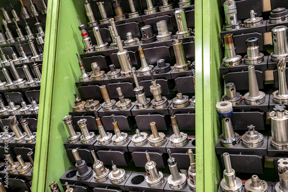 Fototapeta premium Tools for working on a CNC machine are arranged in racks for quick search and selection.