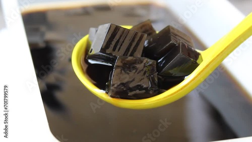 Blurry footage of traditional jelly made from plant Platostoma palustre as beverage. Called as cincau hitam or janggelan in Indonesia