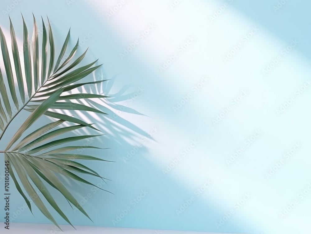 Blurred shadow from palm leaves on the light blue wall. Minimal abstract background for product presentation. Spring and summer. 