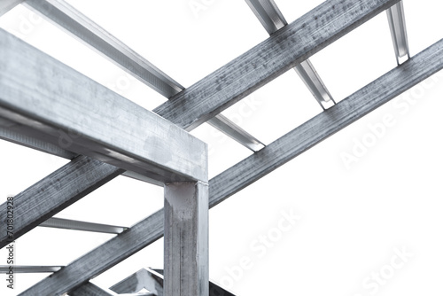 Steel beam structure roof building site isolated on white background, Modern metal structure house wire fence