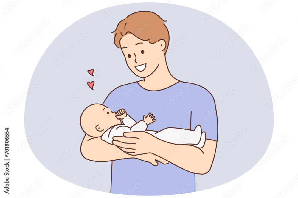 Happy father holding baby in arms Happy father holding baby in arms