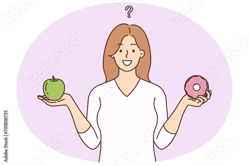 Smiling woman choose between healthy and unhealthy food