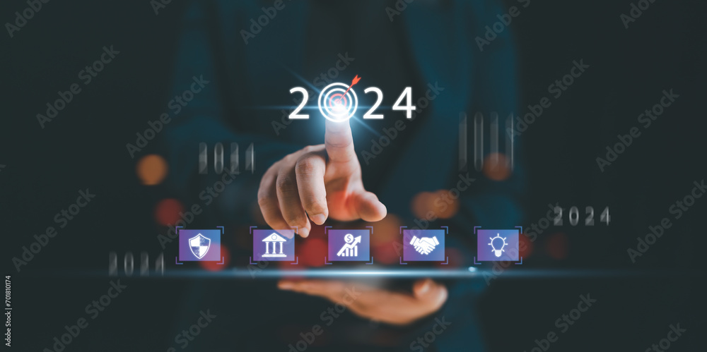 Fototapeta premium 2024 Business development to success and growing growth concept.business strategy, Action plan, Goal and target, hand stack woods block step on table with icon about business strategy and Action plan.