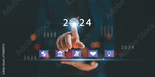 2024 Business development to success and growing growth concept.business strategy, Action plan, Goal and target, hand stack woods block step on table with icon about business strategy and Action plan.