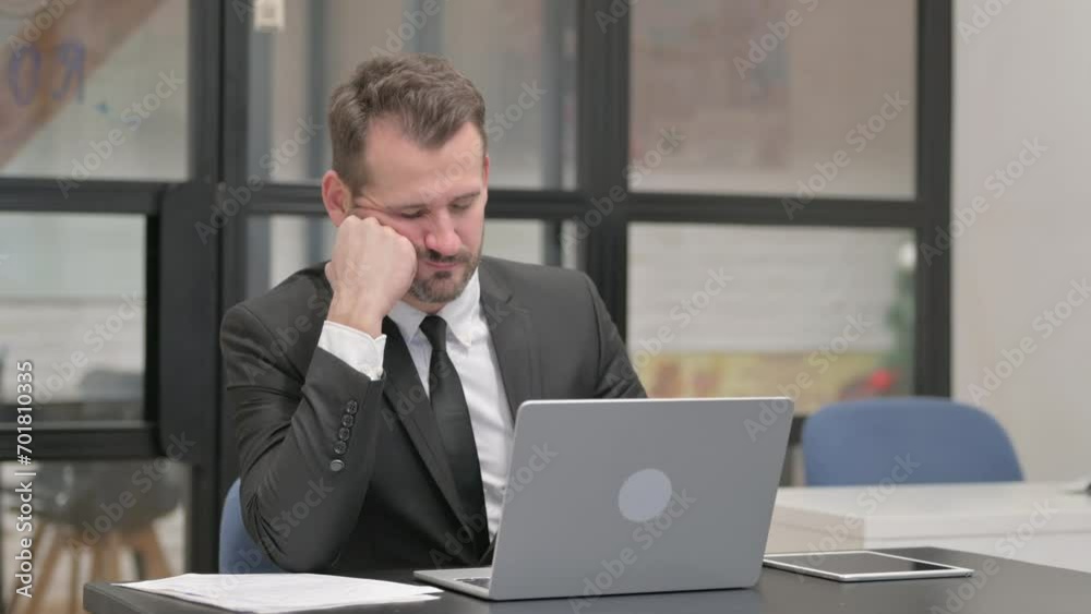 Businessman Falling Asleep while Working on Laptop Businessman Falling Asleep while Working on Laptop