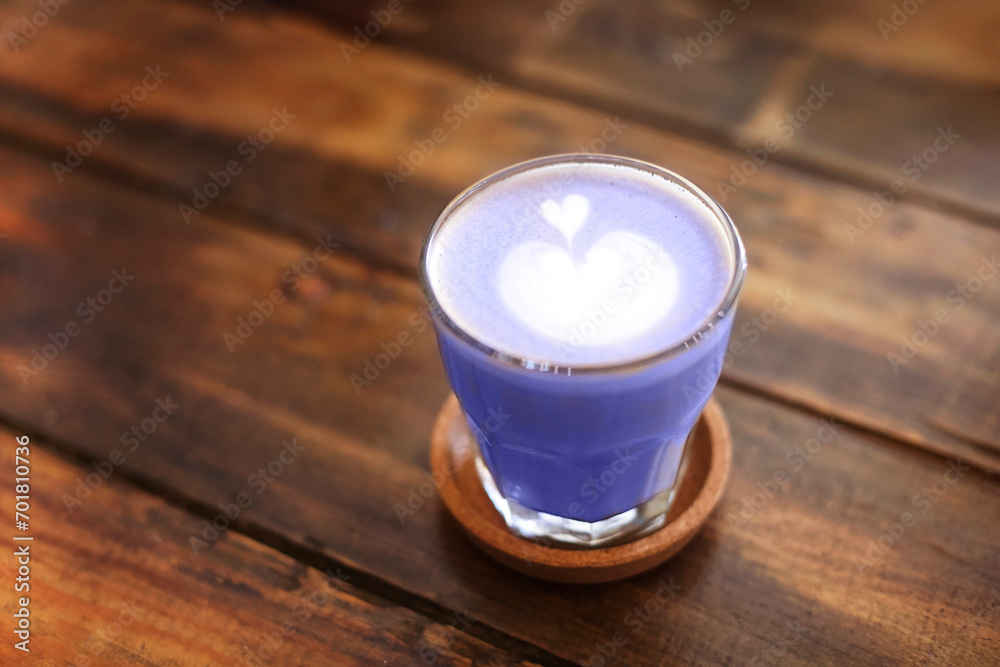 Glass mug with latte on wooden table Glass mug with latte on wooden table