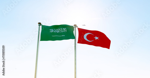 Turkey and Saudi Arabia Flags are waving in the spring of the blue sky, looped video. 4K ULTRA HD. 