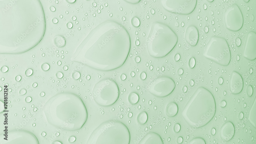 Illustration of a light green background with clear drop patterns