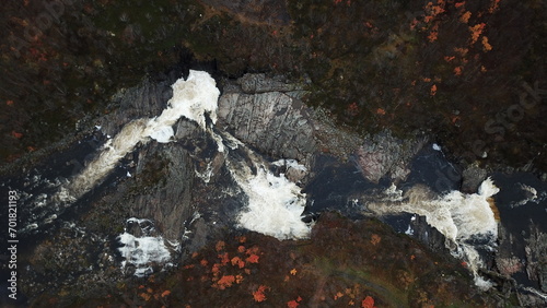 a mountain waterfall from a bird's eye view in autumn