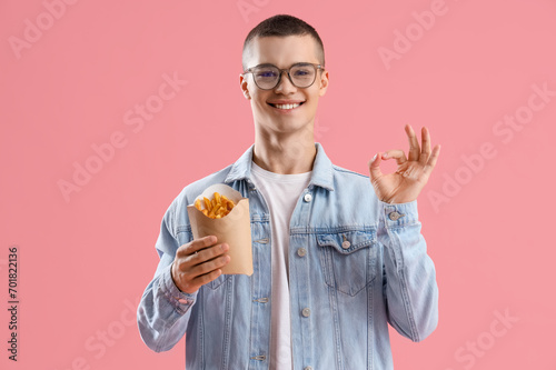 Young man with french fries...