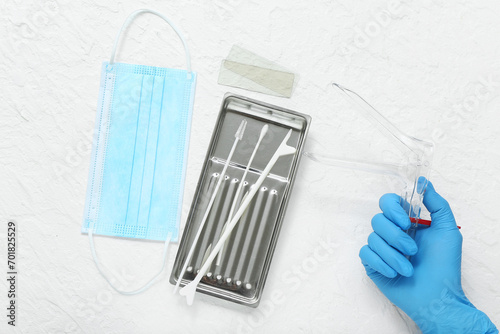 Hand in medical glove, with...