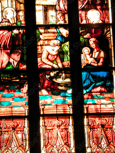 Biblical scenes on stained glass. Arch-see in Frombork.