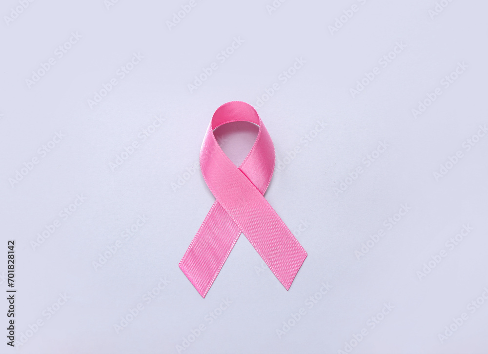 Pink ribbon on light background. Breast cancer awareness concept