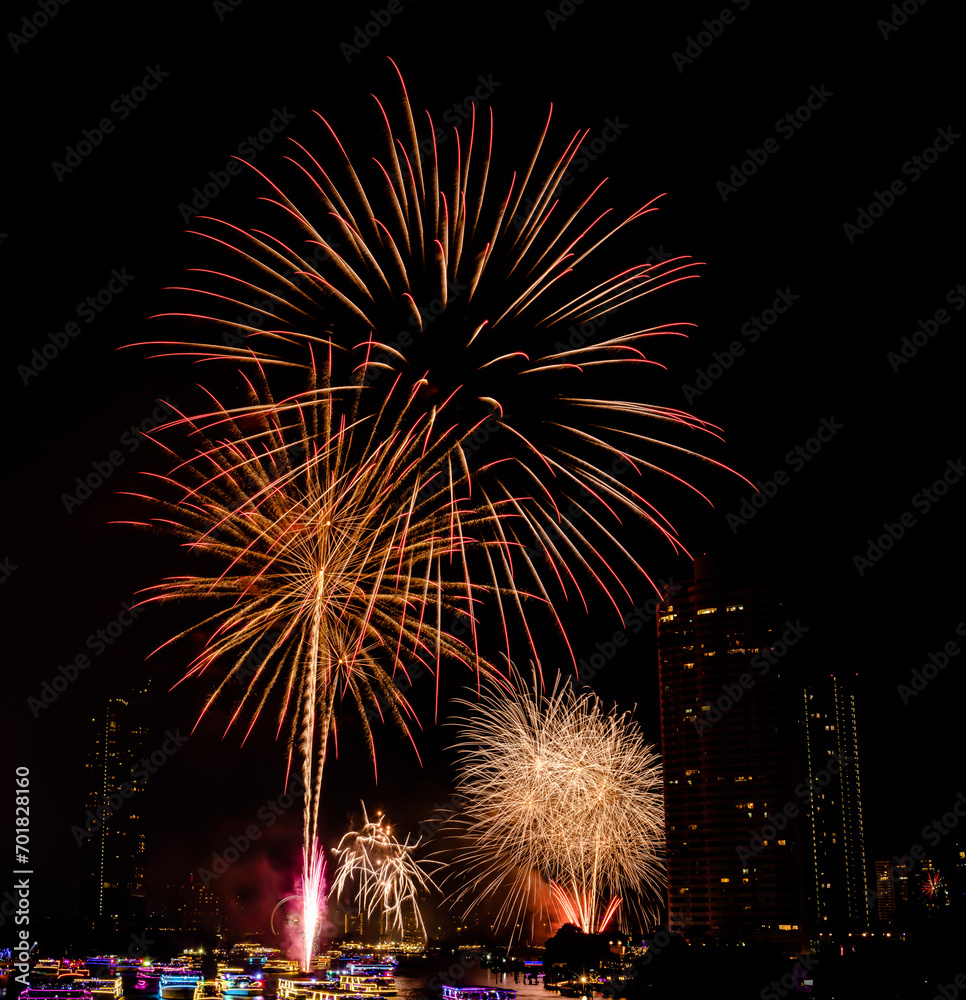 Firework show to celebrate of the new year 2024 along Chao Praya River with the night scene on Asiatique landmark side in Bangkok city, Thailand. Firework show to celebrate of the new year 2024 along Chao Praya River with the night scene on Asiatique landmark side in Bangkok city, Thailand.
