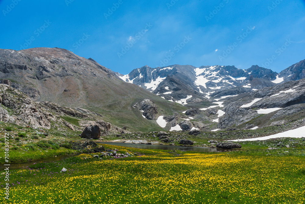 Bolkar mountains from various angles green colored nature flowing water lakes cloudy sky and steep sharp rock forms