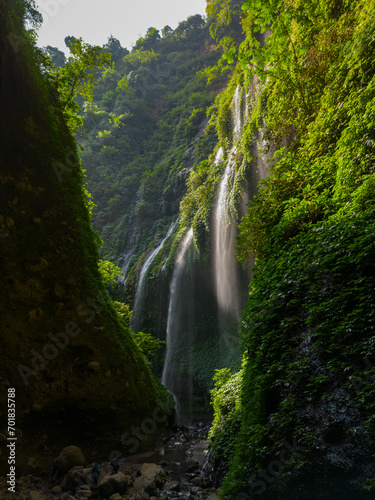 Aerial view of Madakaripura Waterfall in a green canyon located in East Java, Indonesia