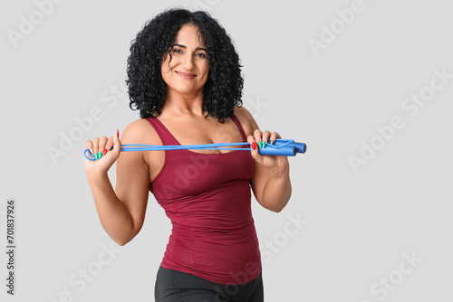 Sporty adult woman with ski...