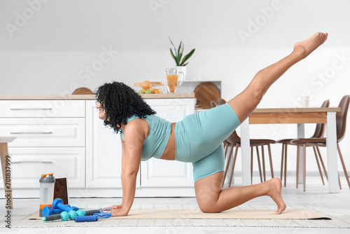 Sporty adult woman practici...