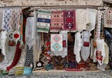 Colorful carpets hanging for sale in Old Ottoman bazaar in Korca, Albania.