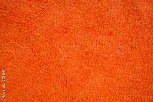 background of orange pumpkin Huun Mayan handmade paper created in Mexico photo