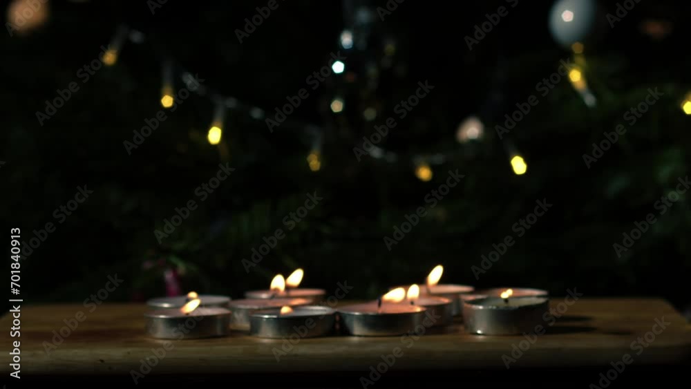 Tealight candles flickering with bokeh background Tealight candles flickering with bokeh background